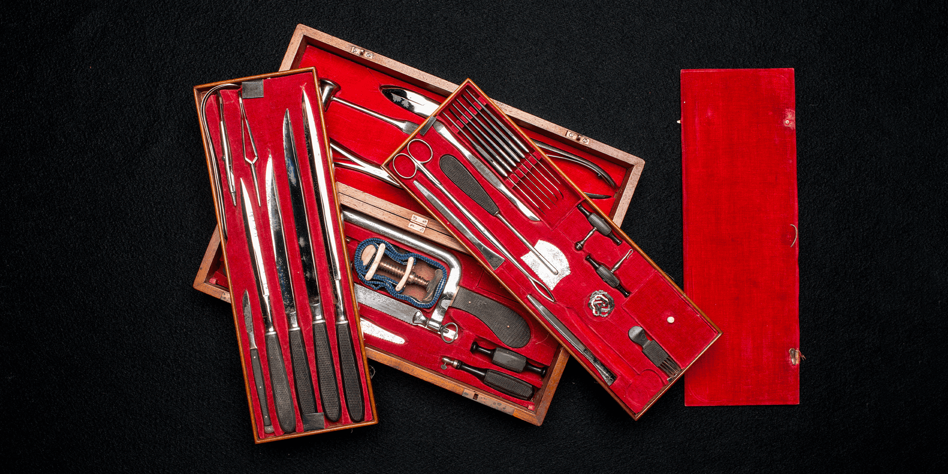 Steel instruments in red velvet-lined wood case
