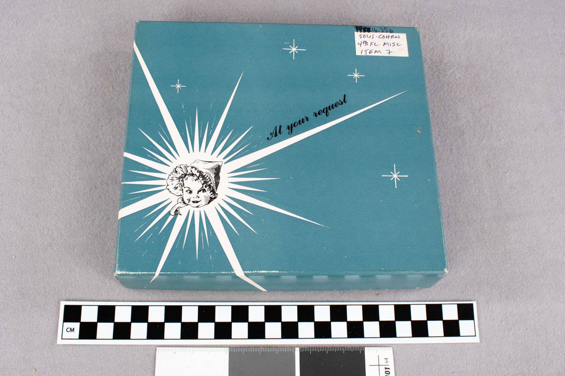 Blue square box with a white sunburst design and a black and white illustration of a baby's face