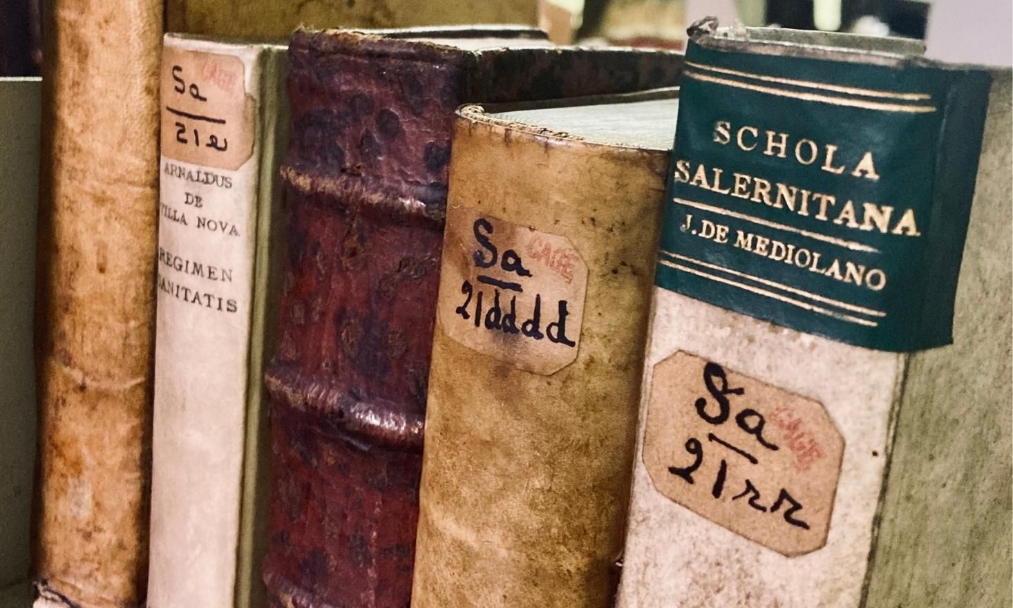 Close up of several old books found in the Historical Medical Library