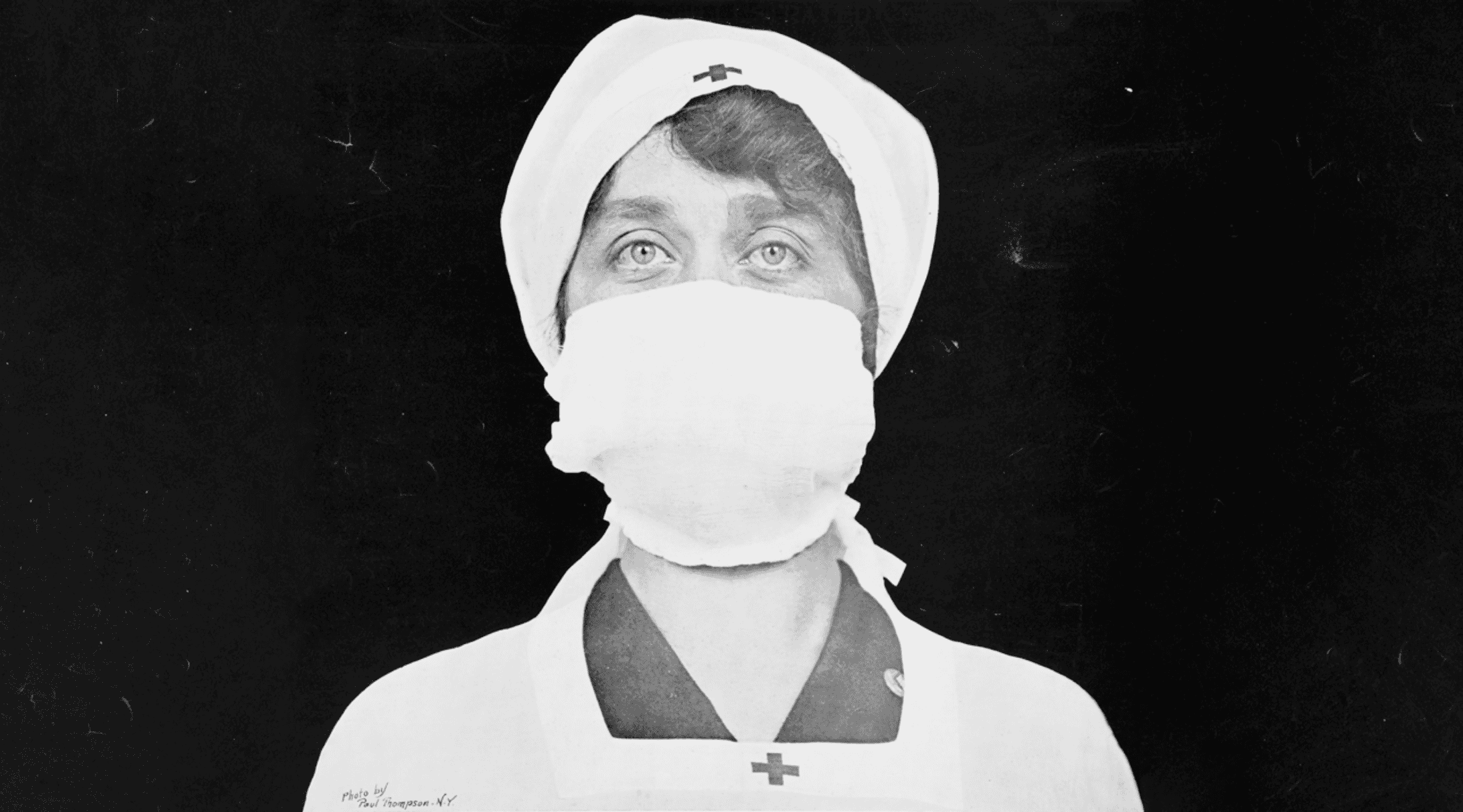 Black and white photo of WWII nurse in surgical mask