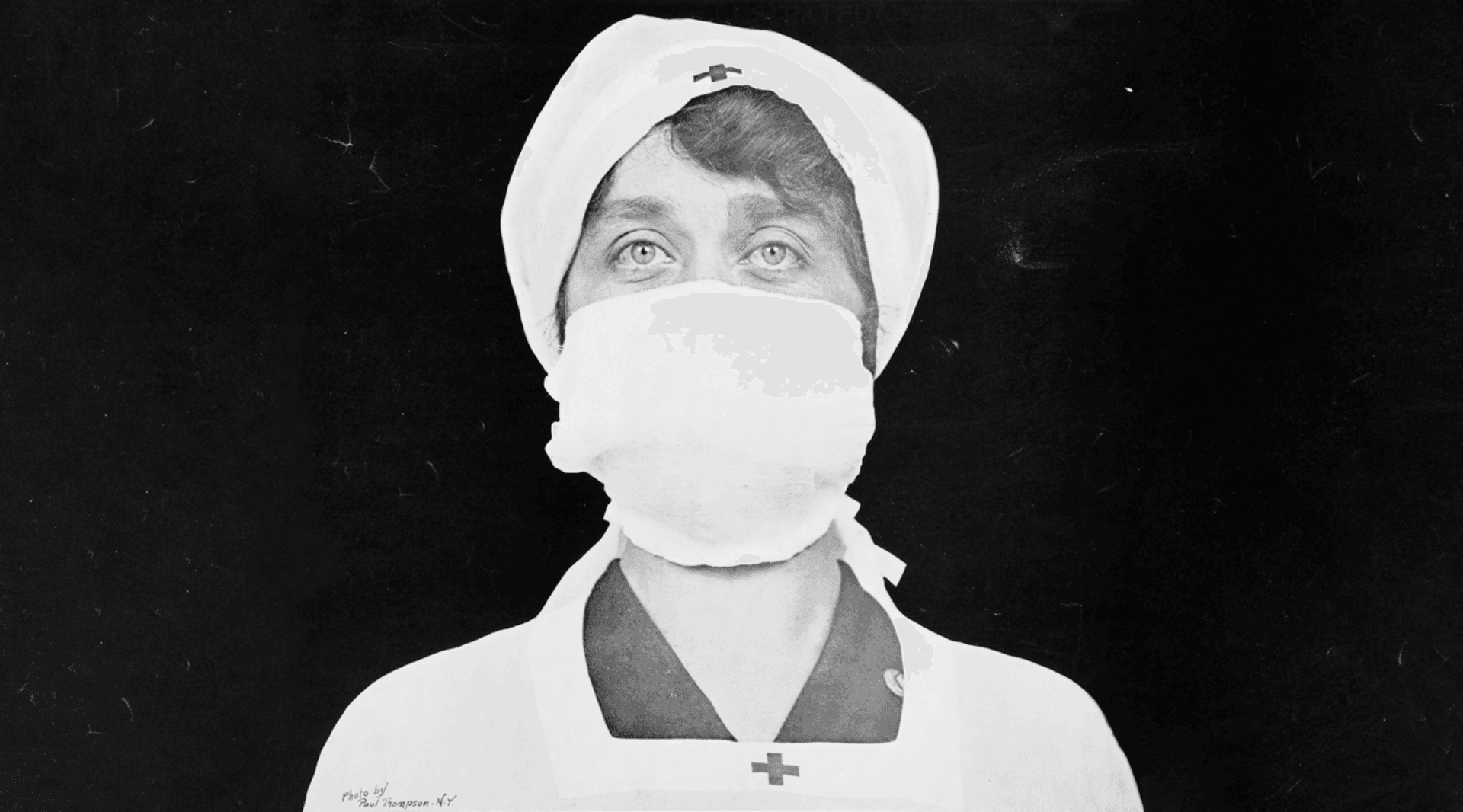 Black and white photo of WWII nurse in surgical mask