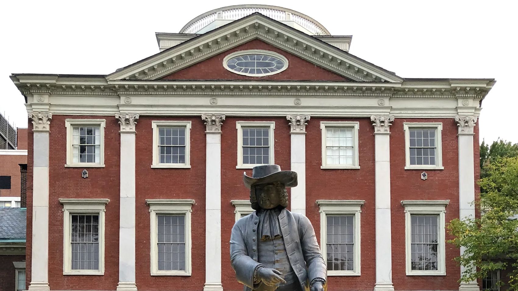 Main building of Pennsylvania hospital with statue of a man in front